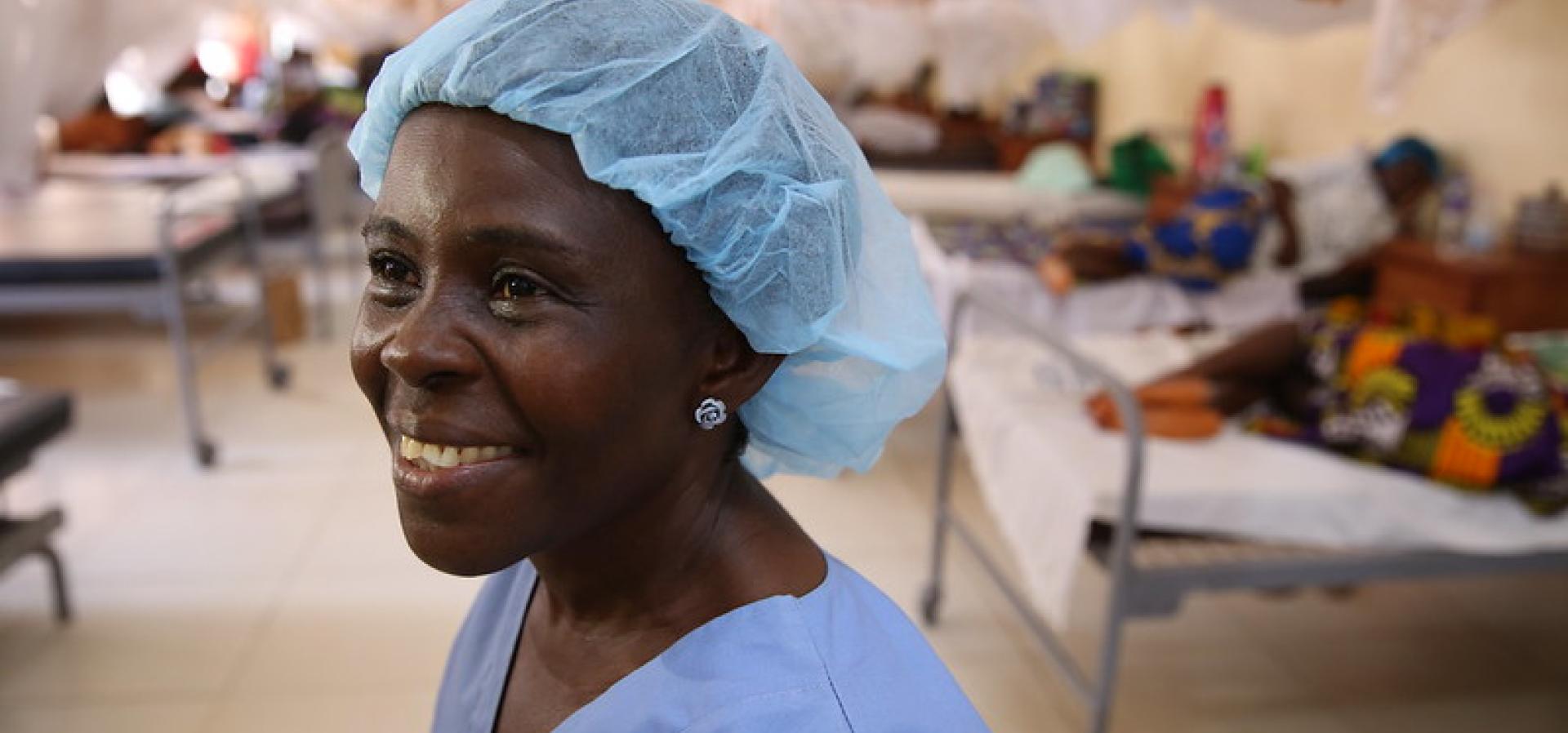 The Pandemic Fund Female nurse in rural hospital with blue nurse clothes on