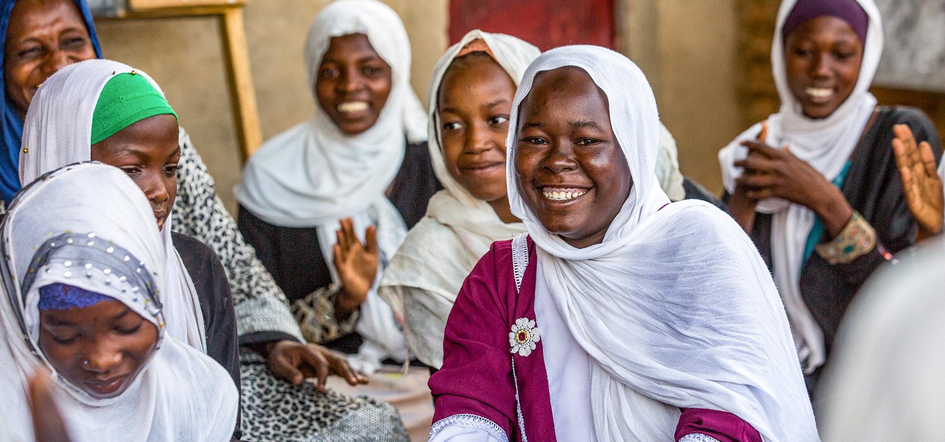 African Women looking at camera, smiling