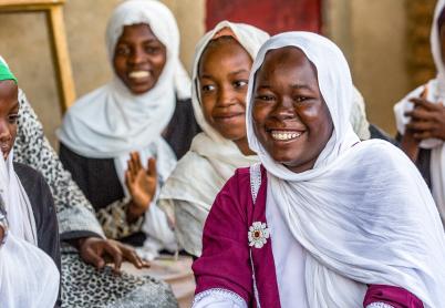 African Women looking at camera, smiling