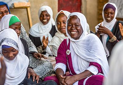 African Women looking at camera, smiling
