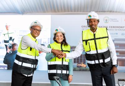 People in vests shaking hands